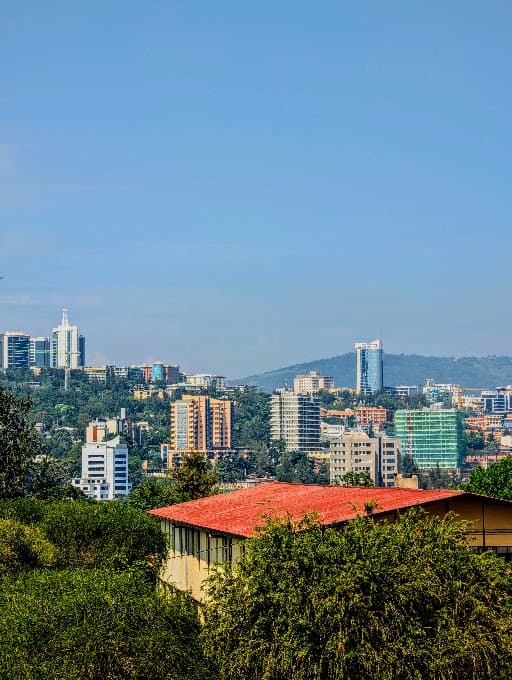 Kigali skyline rising over green hills